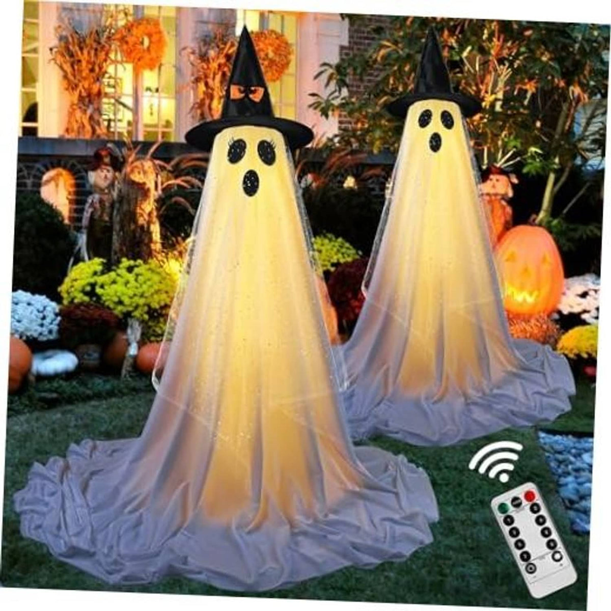 Set of two standing Halloween ghost decorations, black hats and dotted faces, draped white fabric.