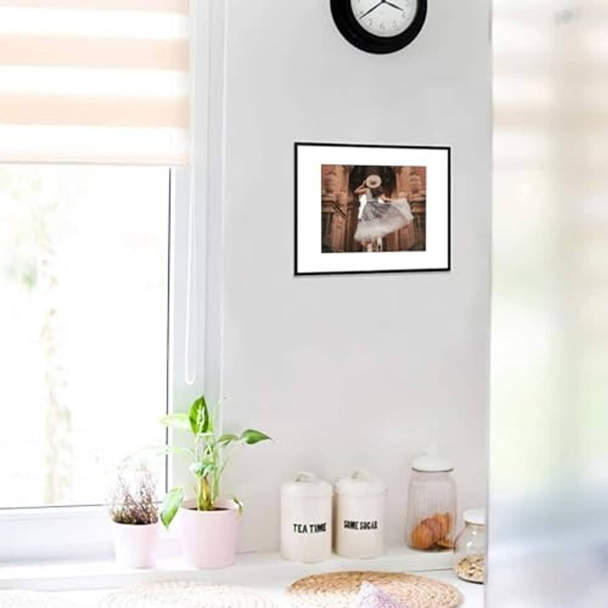 Black aluminum picture frame with white mat, hanging photo with a person