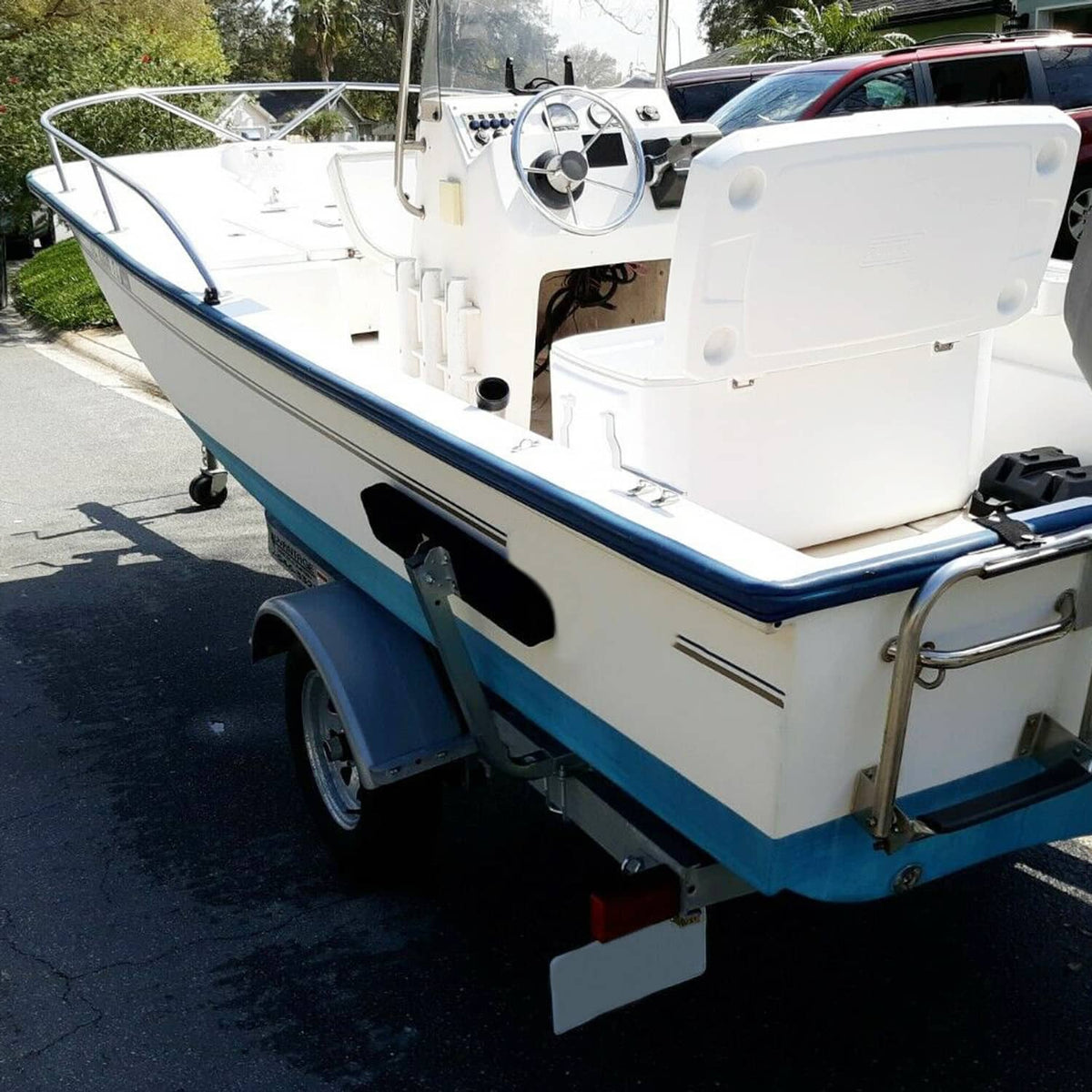 Boat trailer side bunk guide bar assembly along the hull