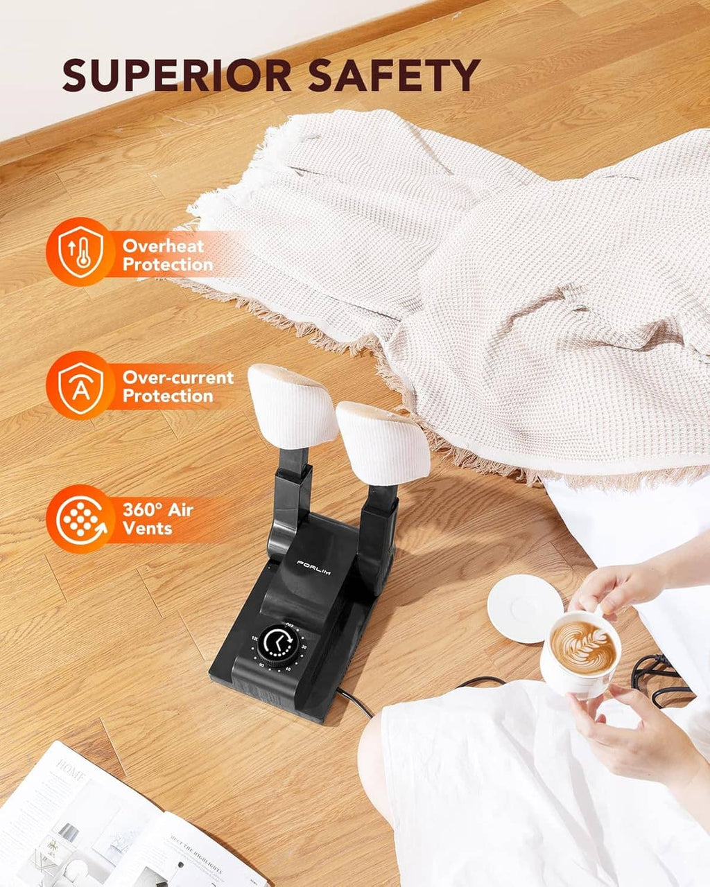 Boot dryer on floor, heating arms positioned near white towel and boots