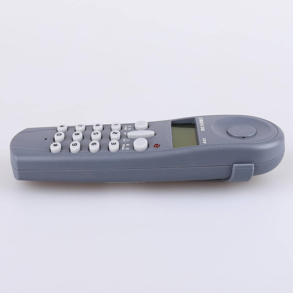 Phone line tester top view with keypad, LCD, and power control button