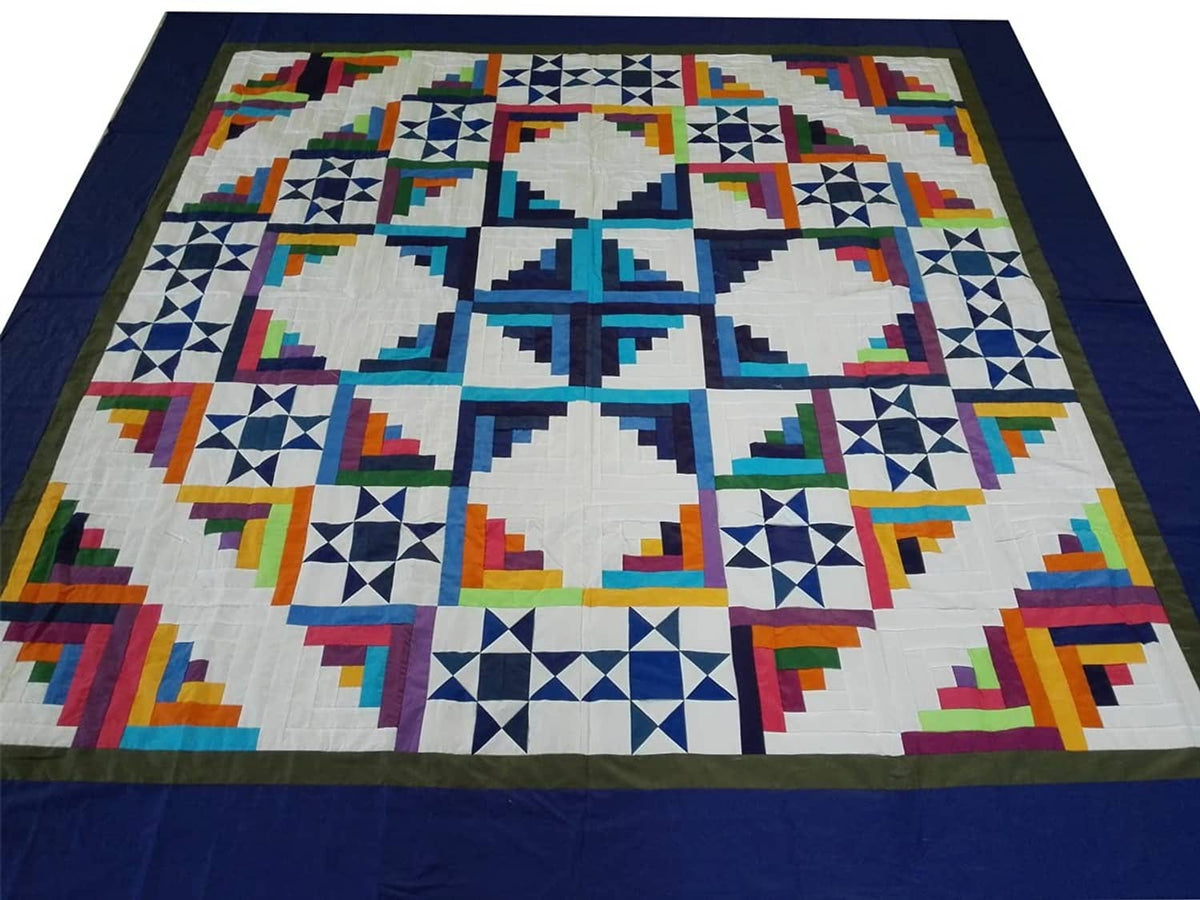 Large patchwork blanket top with blue backdrop and multicolor geometric blocks
