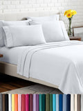 White queen bed linen set with pillowcases, flat sheet, and fitted sheet