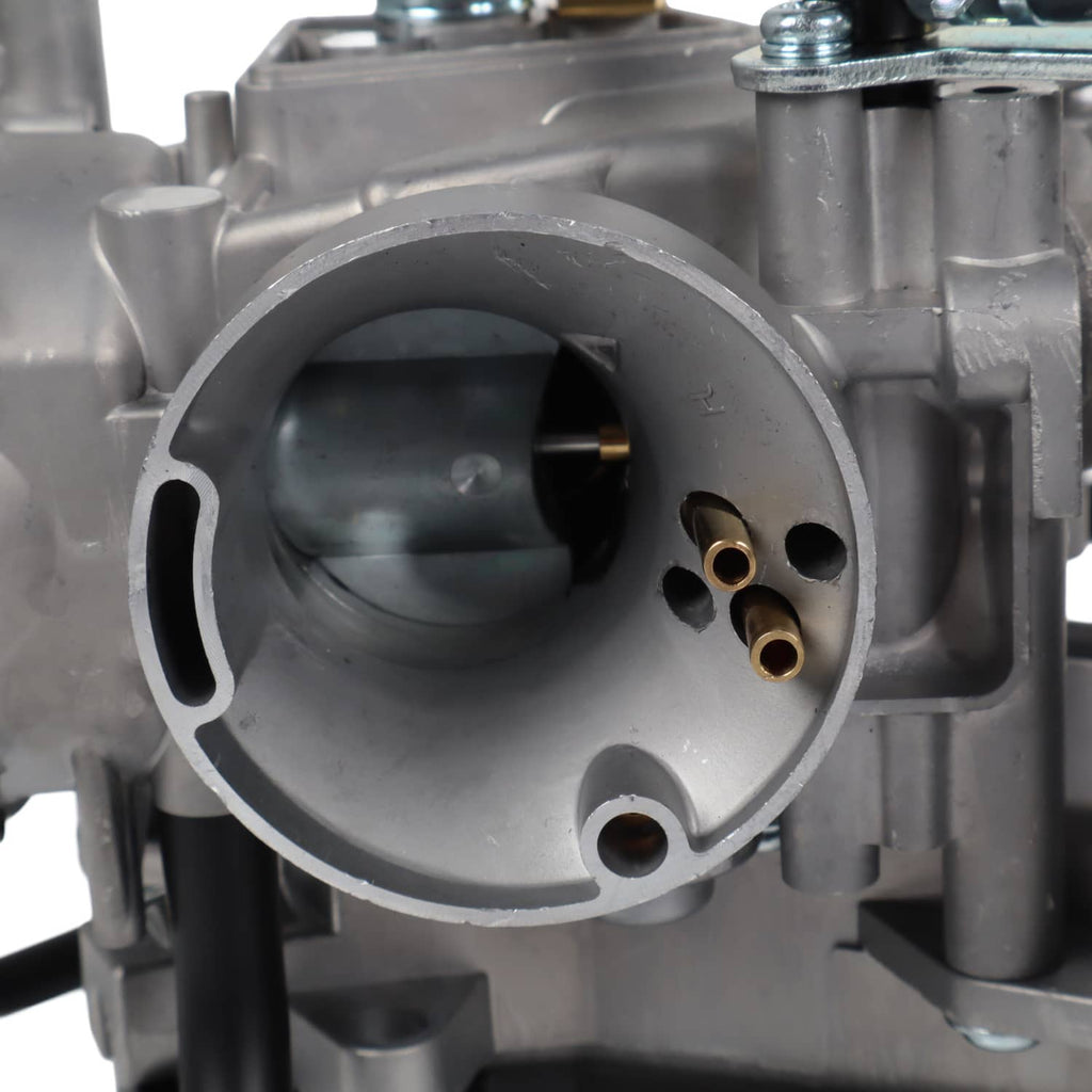 Carburetor intake opening with brass ports and surrounding metal casting