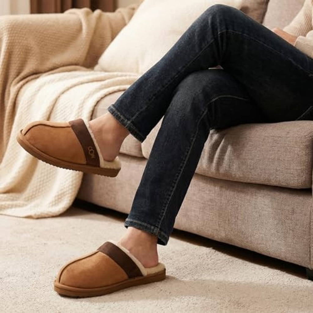 Men's chestnut fuzzy-lined slippers worn with dark jeans
