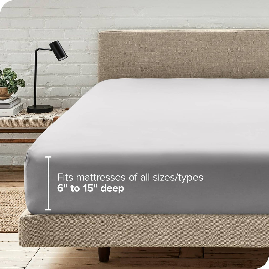 Light grey deep fitted sheet on mattress with secure elastic skirt
