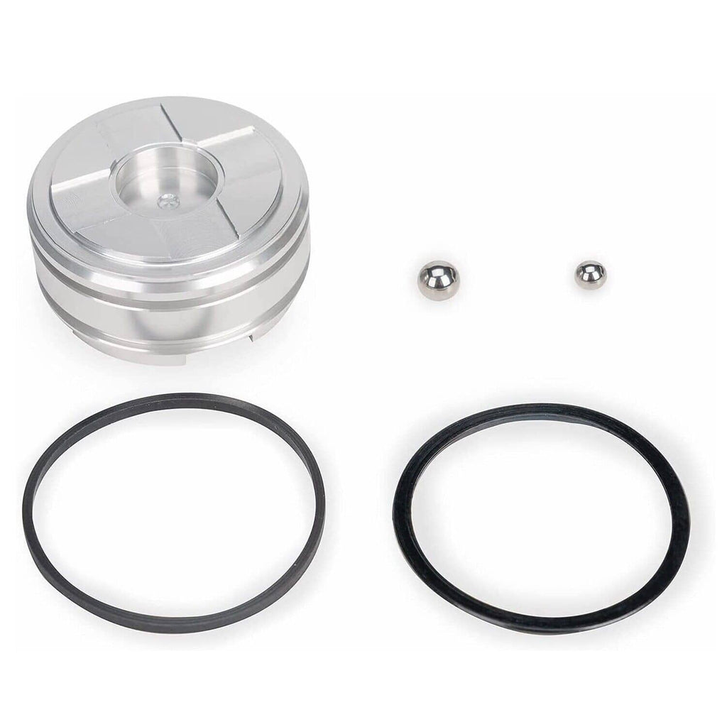 Forward accumulator piston kit: silver piston with black seals and two metal balls