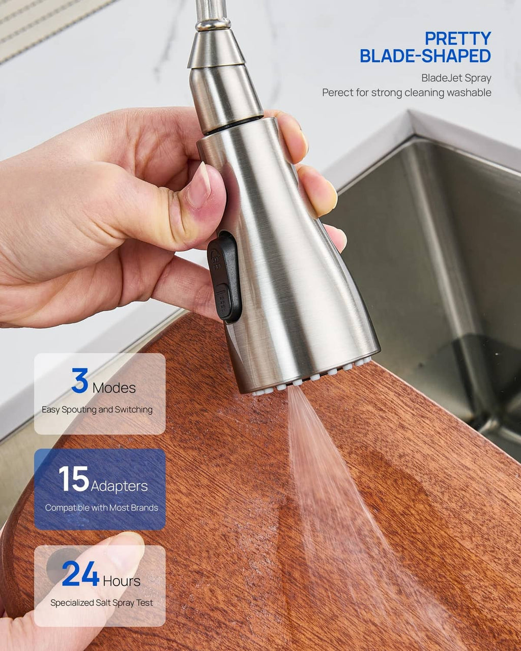 Brushed metal sprayer head held above sink edge with 3-mode black controller button