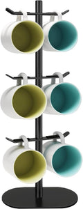 Black metal cup holder tree with six hooks and three rows of mugs in green and teal