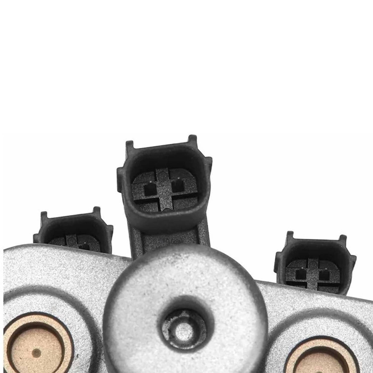 Vehicle valve body assembly close-up of round sensor caps with black connector blocks