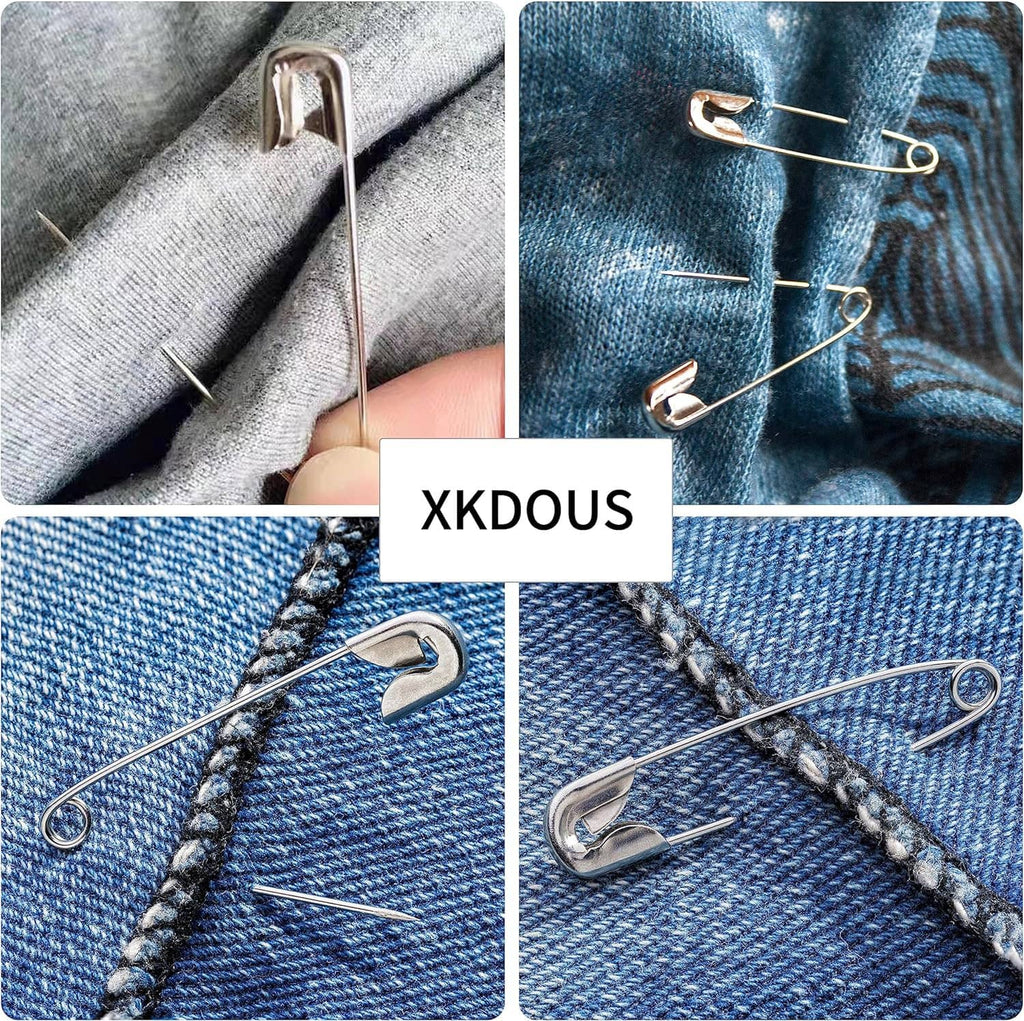 Silver safety pins secured on denim fabric panels, showing pin placement and closure