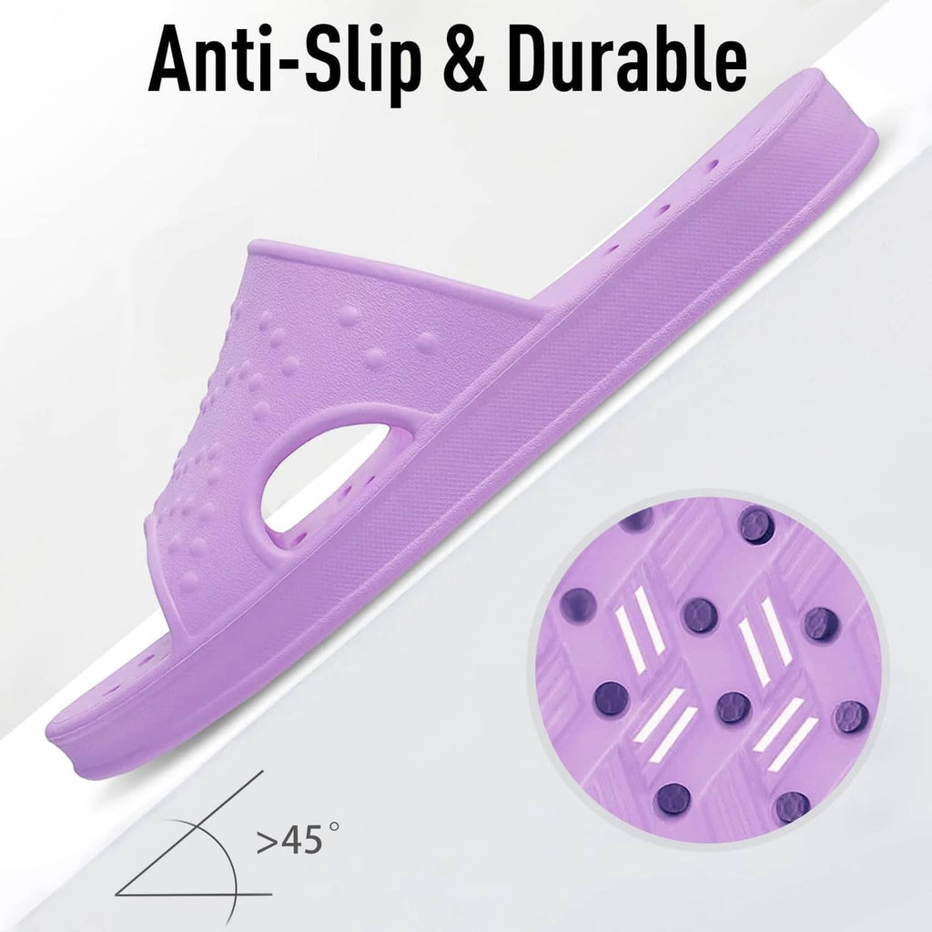 Purple anti-slip shower slides with patterned outsole tread.