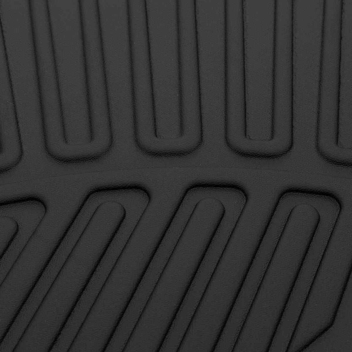 Black TPE mat close-up of molded traction grooves