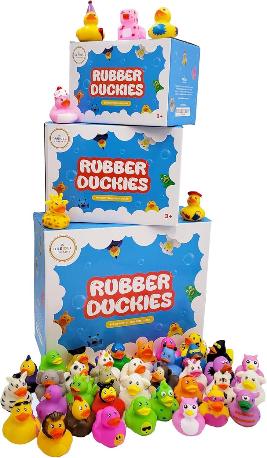 Stacked boxes of assorted rubber duck bath toys with colorful duck figures on packaging
