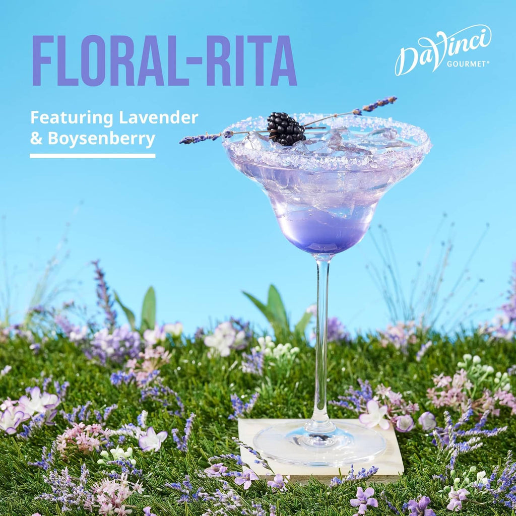 Lavender syrup cocktail in a martini glass with berry and lavender garnish