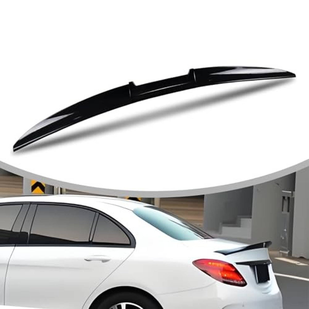 Black tail wing spoiler mounted on the rear of a white car