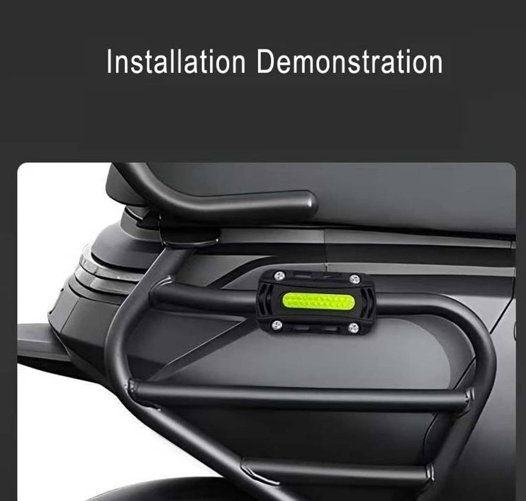 Black crash bar bumper block installed on motorcycle crash bar with neon reflective strip