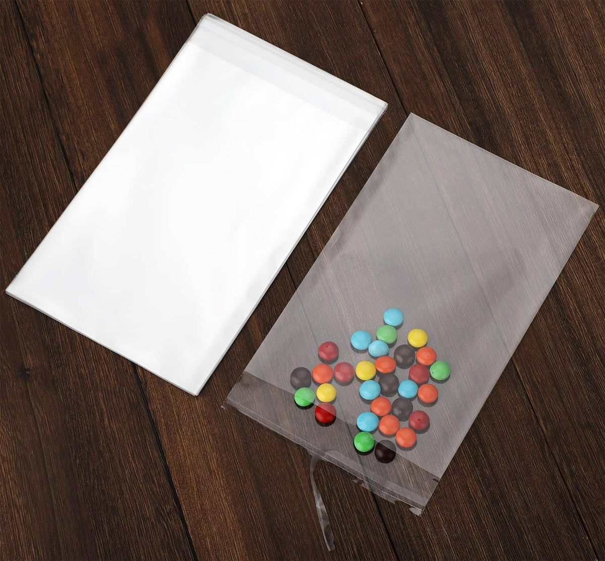 Clear resealable cello bag pair; one filled with colorful beads, transparent pouch