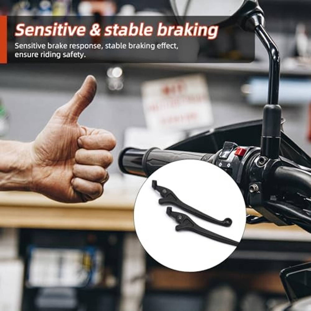 Black disc brake lever near handlebars with a thumb-up in a workshop setting