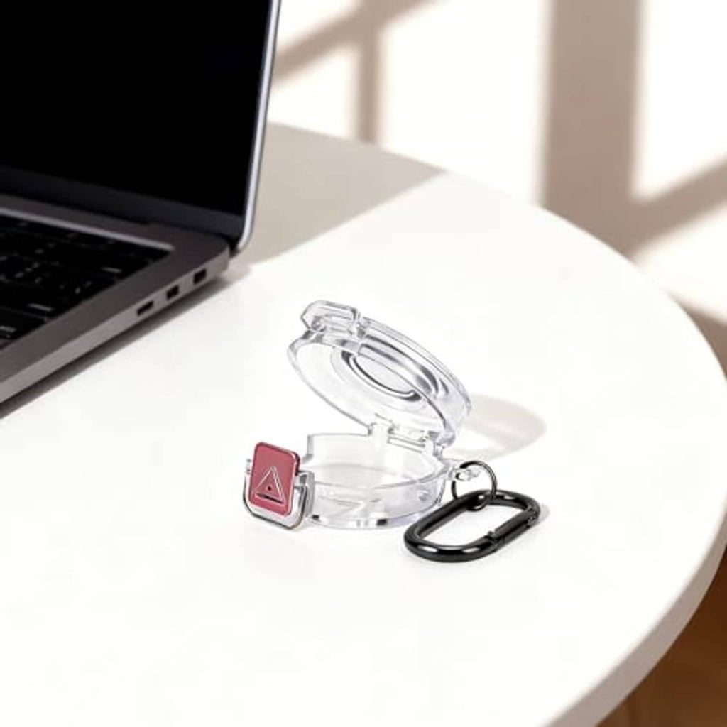 Transparent charger case with red port insert and black carabiner keyring on table
