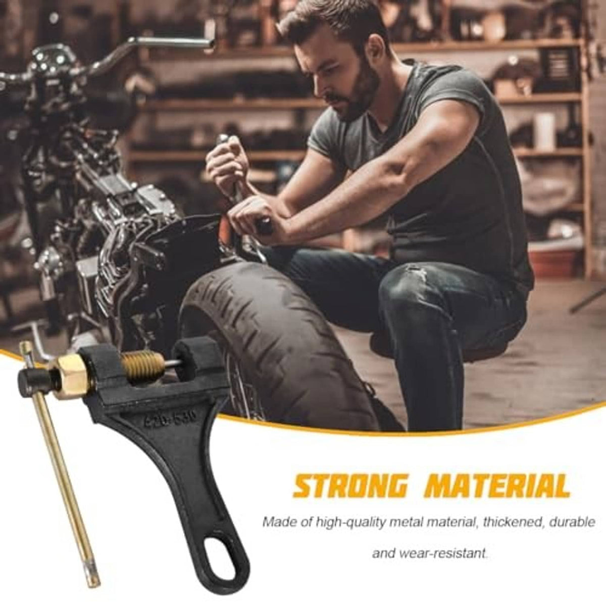Motorcycle chain breaker tool with long lever rod and loop handle near a motorcycle workshop