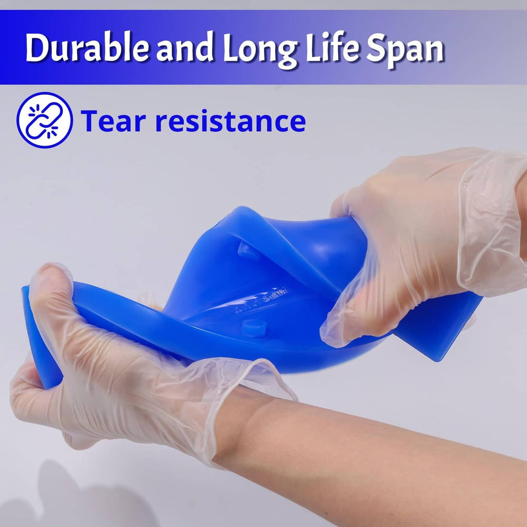 Blue silicone mold in gloved hands, showing small embossed cavities