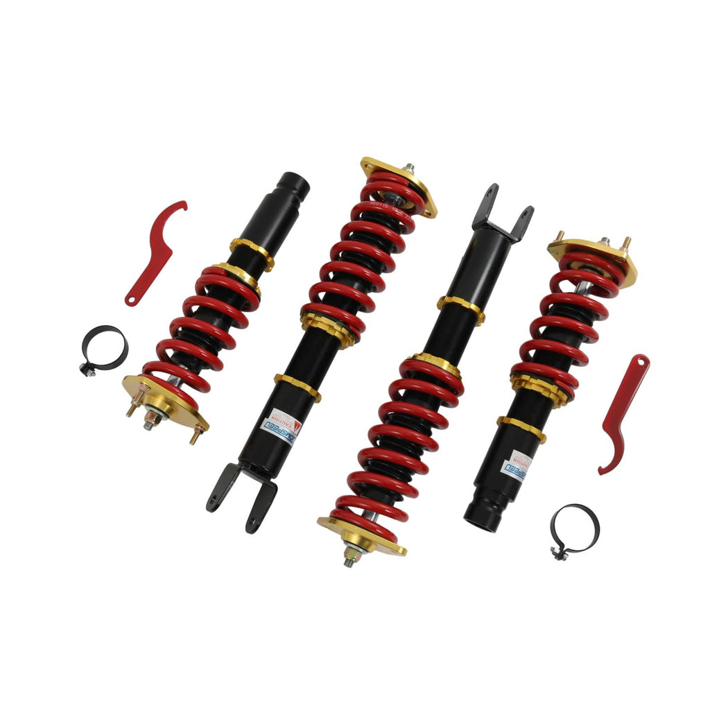 Coilover shock absorbers with red springs, black bodies, gold mounts and included small tools