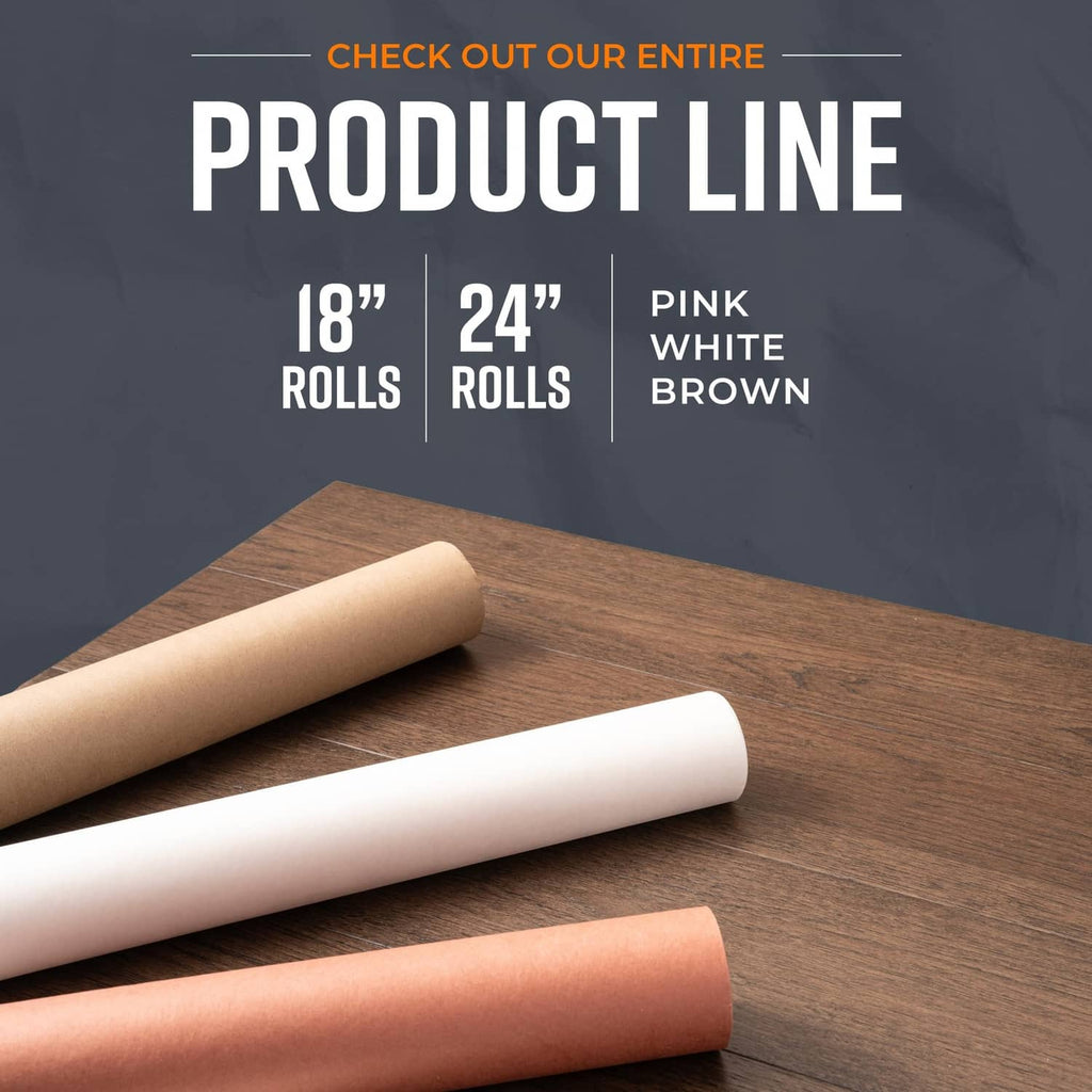 Kraft butcher paper rolls in white and brown resting on a wooden surface
