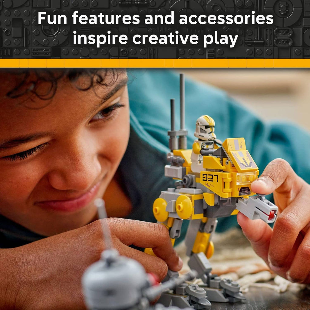 Yellow clone trooper toy and accessories held during hands-on building play