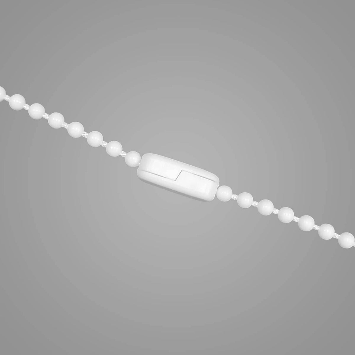 White curtain chain connector on beaded chain links, double-lock close-up