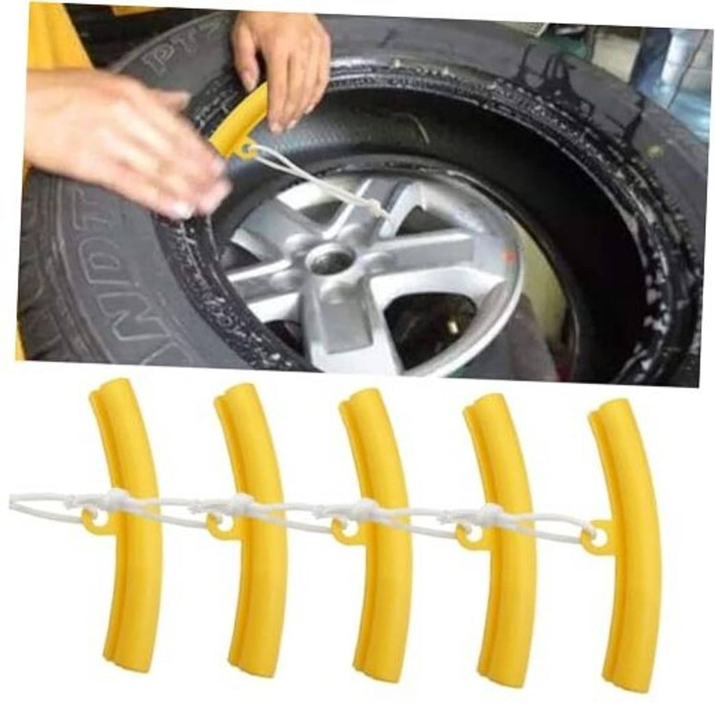 Yellow tire rim protector edge savers set with cord, being placed on a wheel