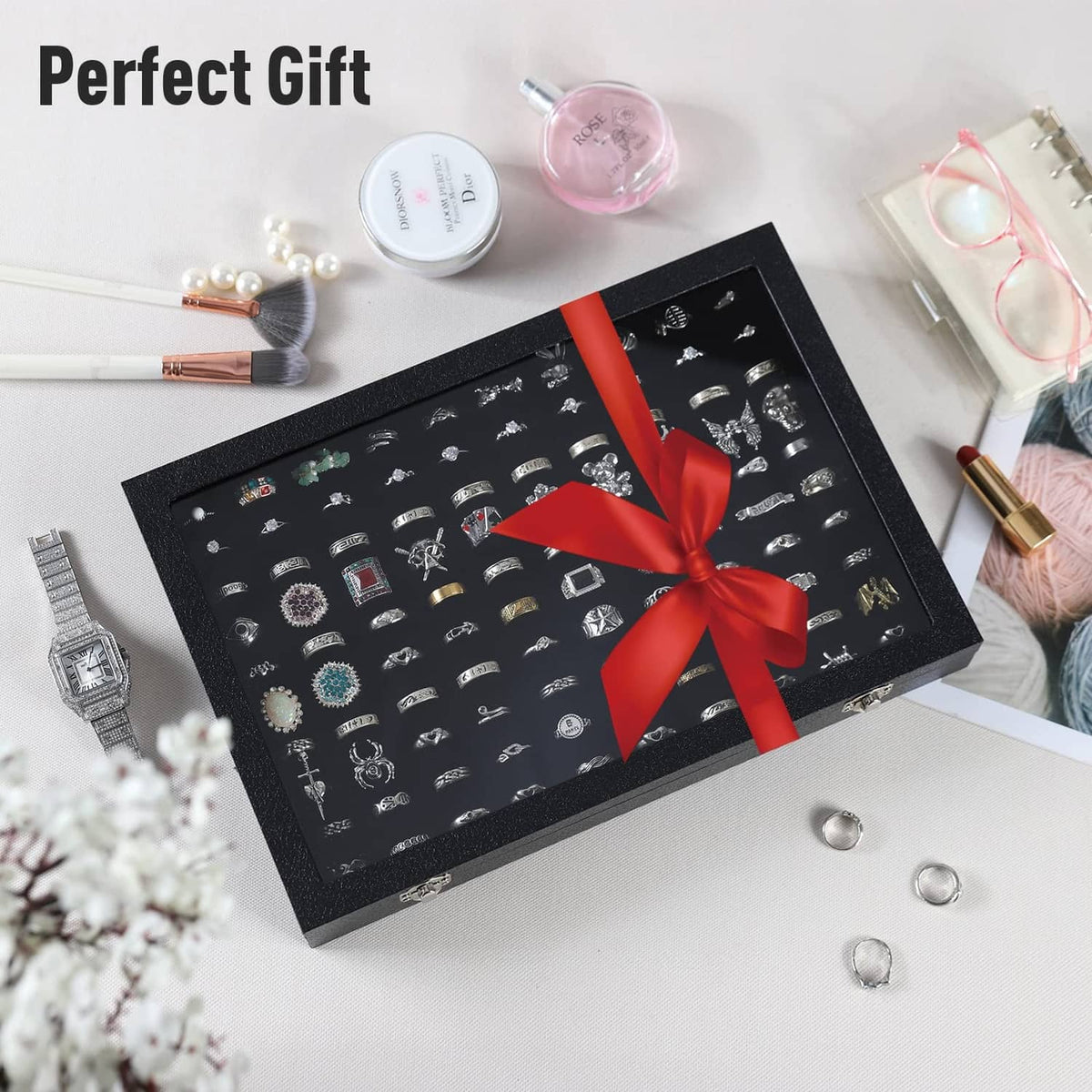 Black ring case organizer box with ring slots tray and red gift ribbon