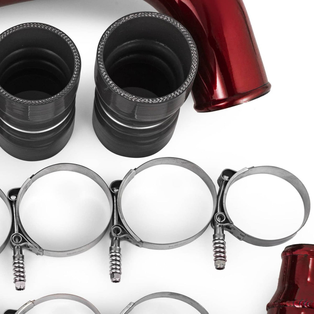 Red intercooler pipe corner with black boots and three stainless clamp rings