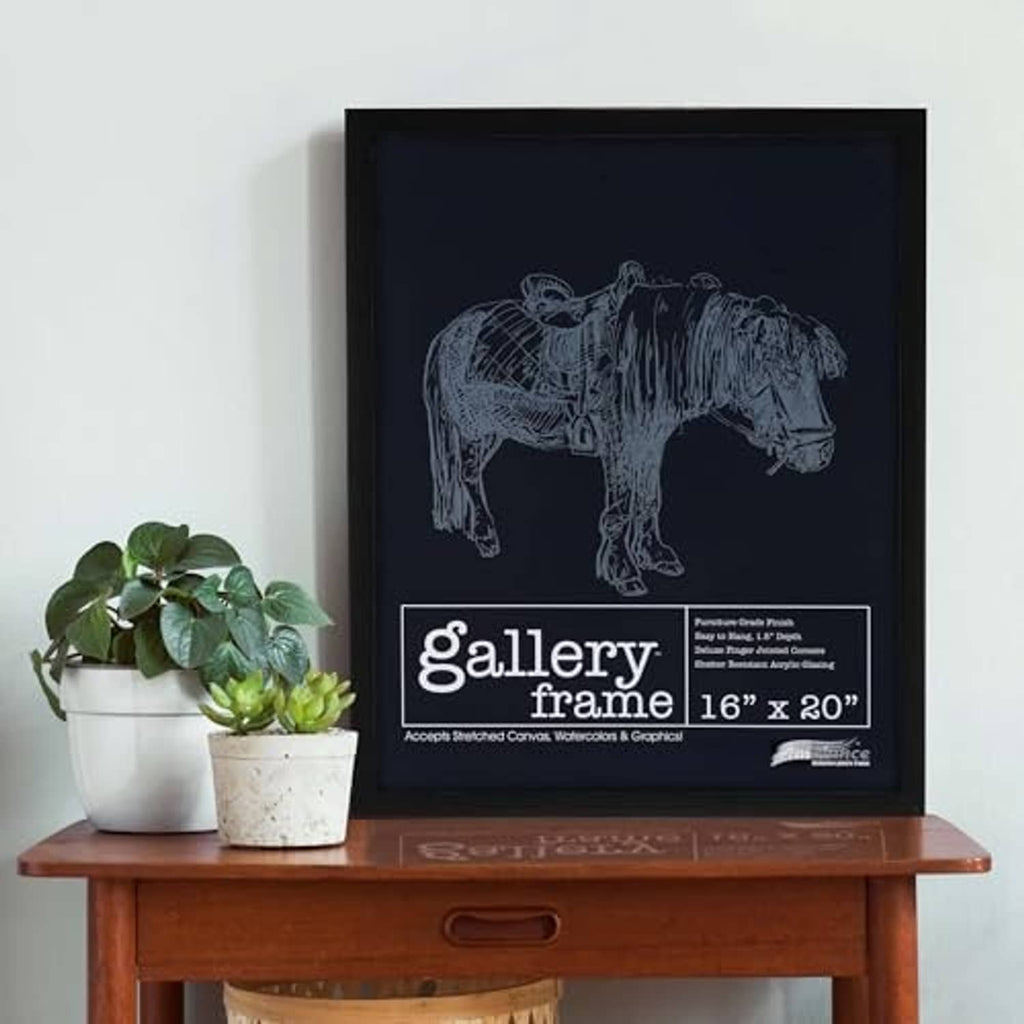 Black wood deep picture frame on table with blue animal print and gallery logo label