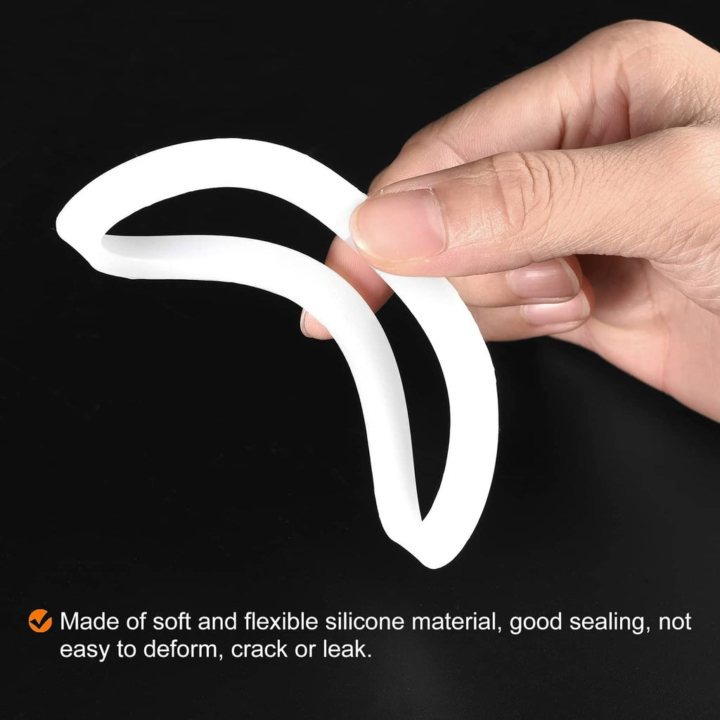 White silicone gasket seal ring, flexible oval loop, held by hand.