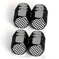 Set of four black tire valve stem caps with checkered logo bands