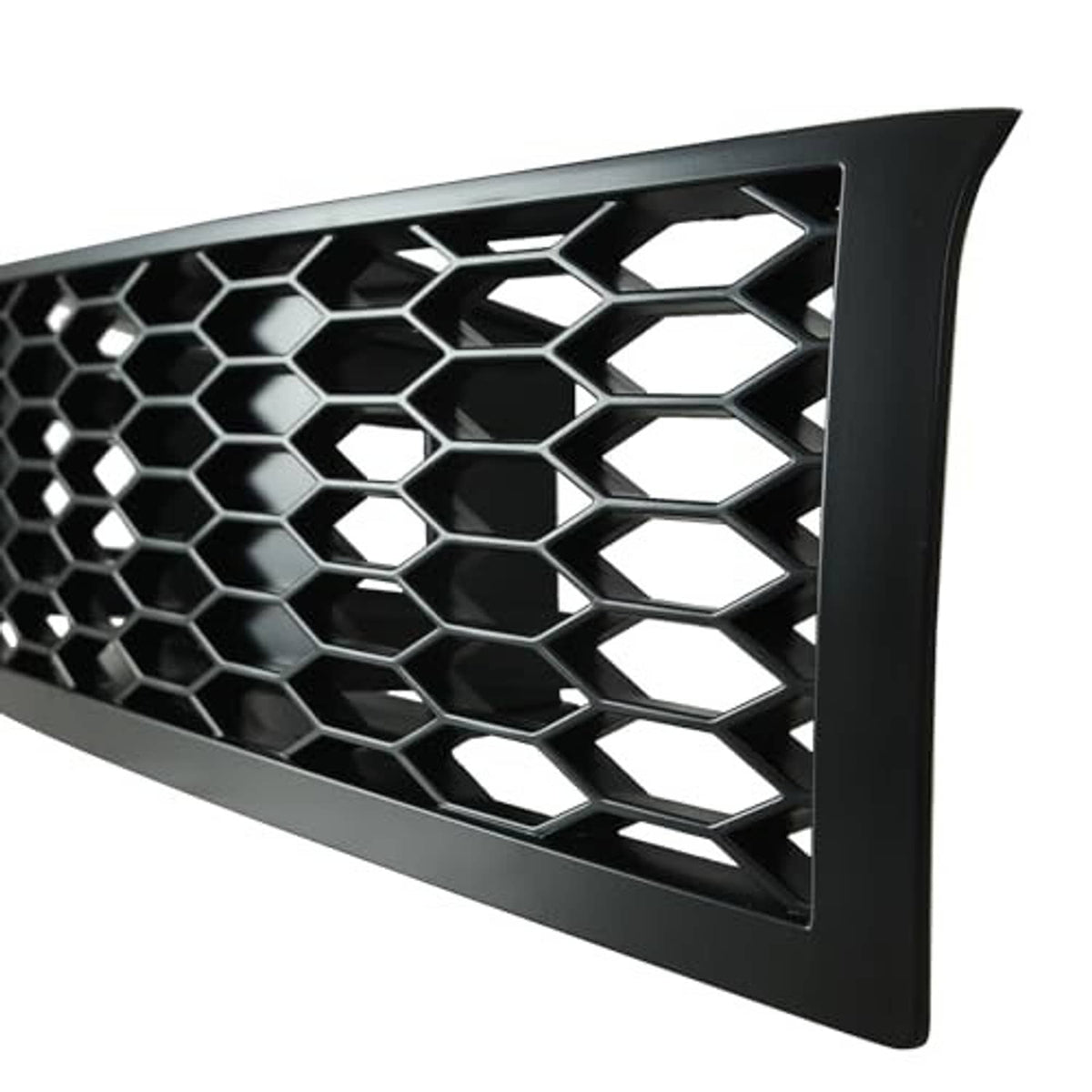 Close-up of hex honeycomb mesh grille with black frame and silver-edged openings
