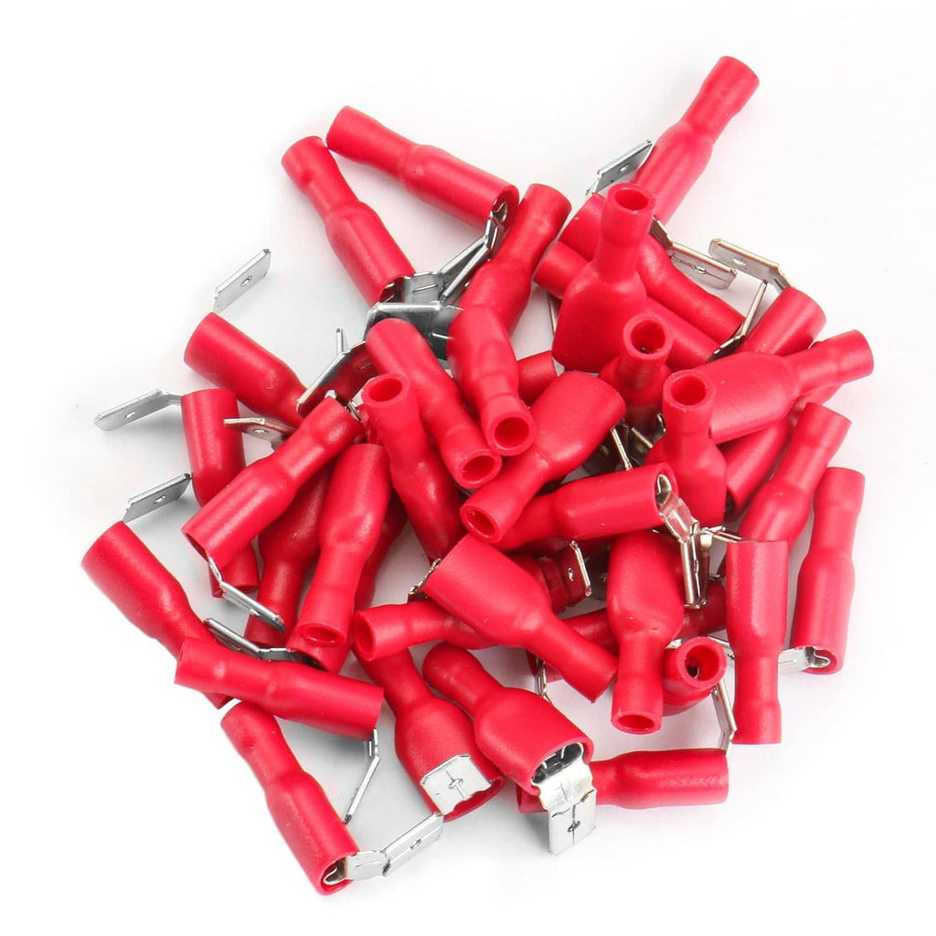 Assorted red insulated spade crimp terminal connectors in a pile