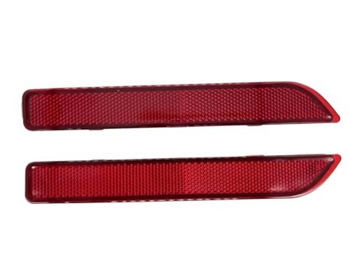 Pair of red rear bumper reflector strips with rounded ends and textured lens surface
