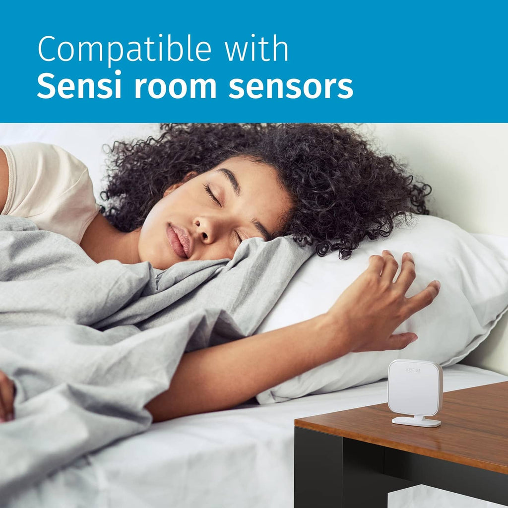 White wireless room sensor device on a bedside table