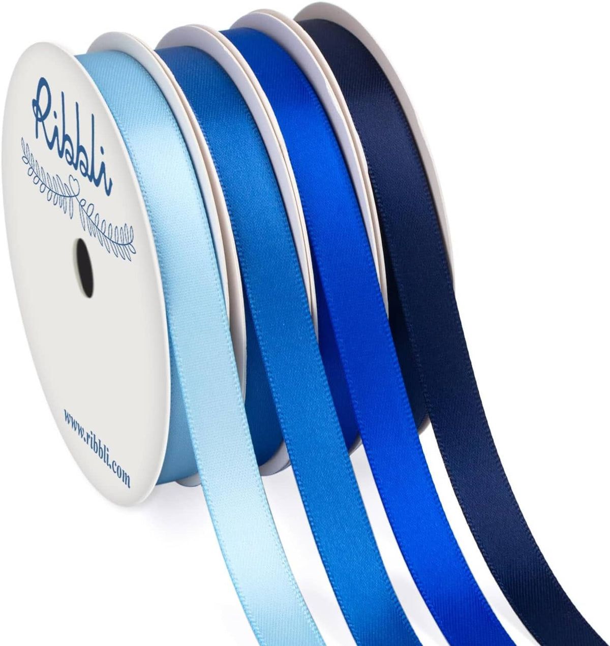 Set of satin ribbon rolls on spools, light blue, royal blue, and navy blue