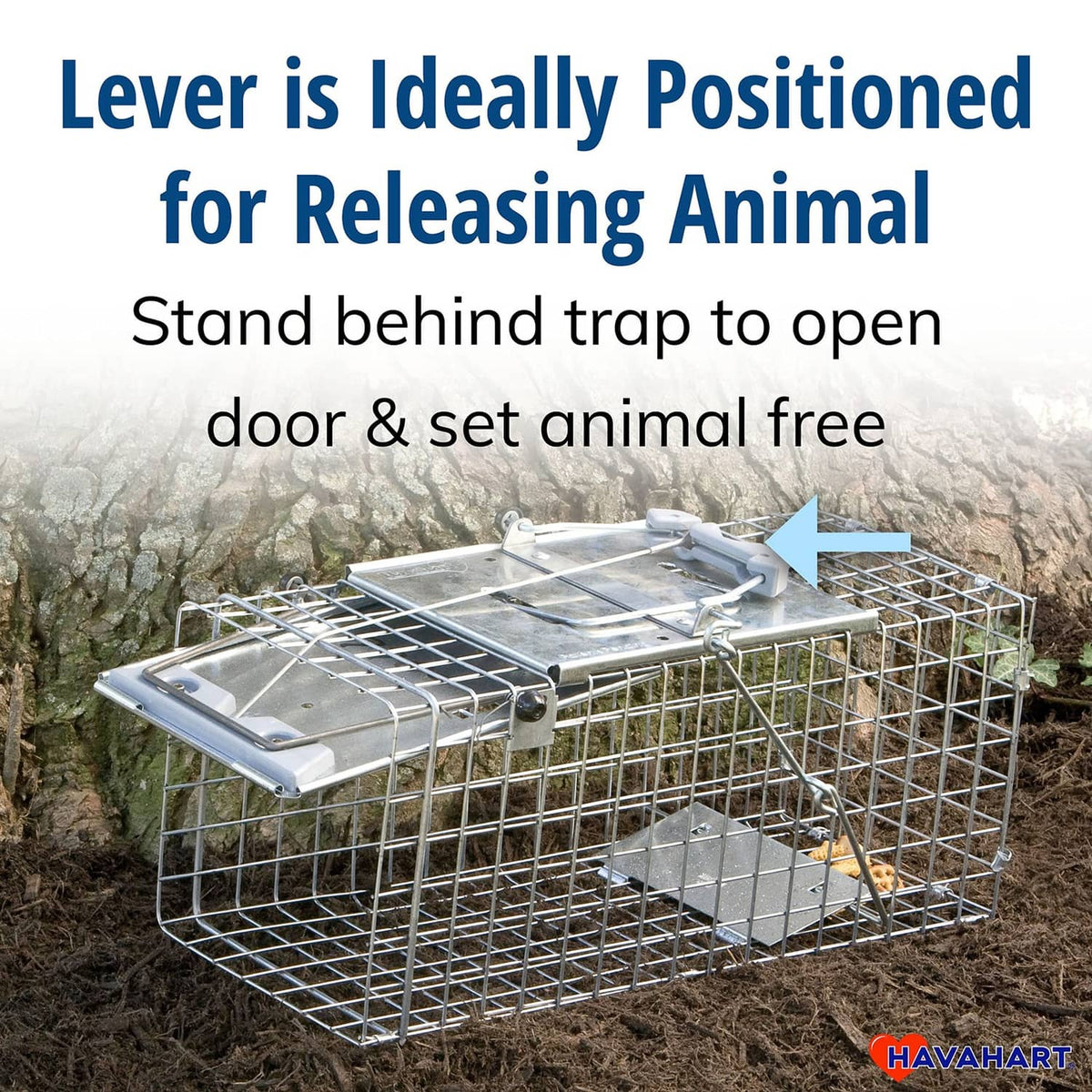 Havahart live trap with open door and release lever on ground