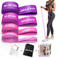 Pink pull-up resistance bands set with 4 resistance levels, shown in use