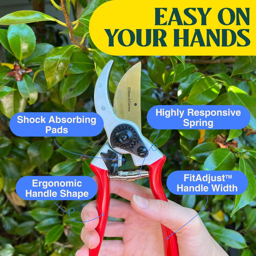 Red and silver pruner with gold blade, spring pads, and ergonomic handle width