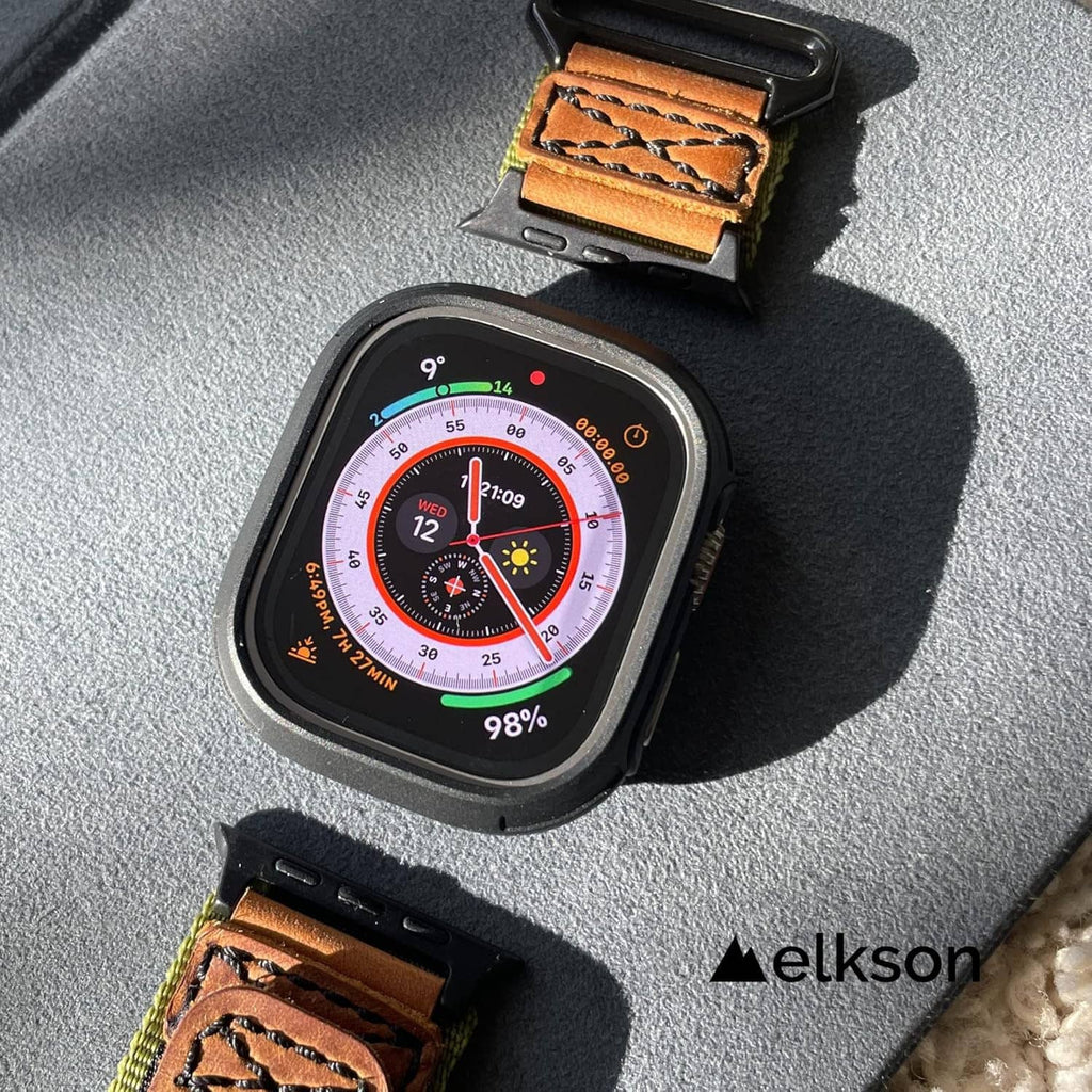 Dark gray bumper case with tempered glass on leather-style tan strap