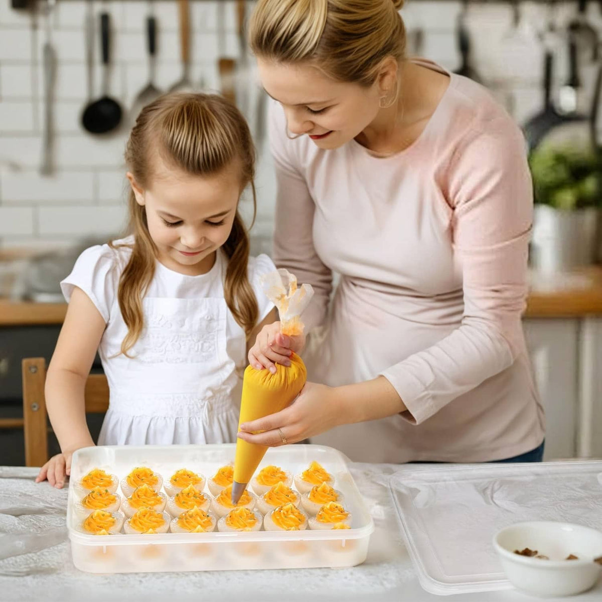 Clear plastic deviled egg tray carrier with lid, filled with piped deviled eggs