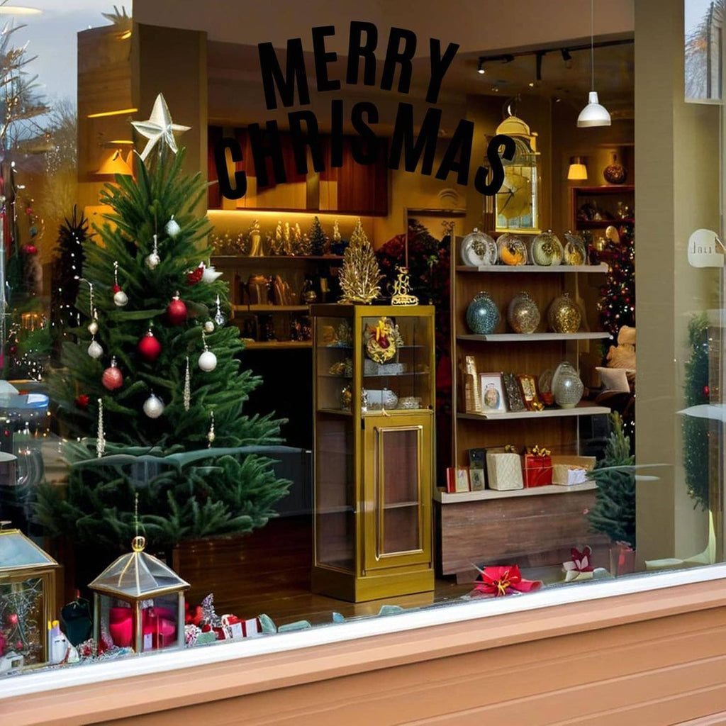 Black alphabet stickers on shop window spelling MERRY CHRISTMAS