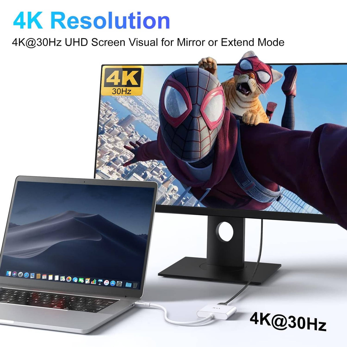 Silver USB-C to HDMI adapter connecting a laptop to an external monitor for 4K.