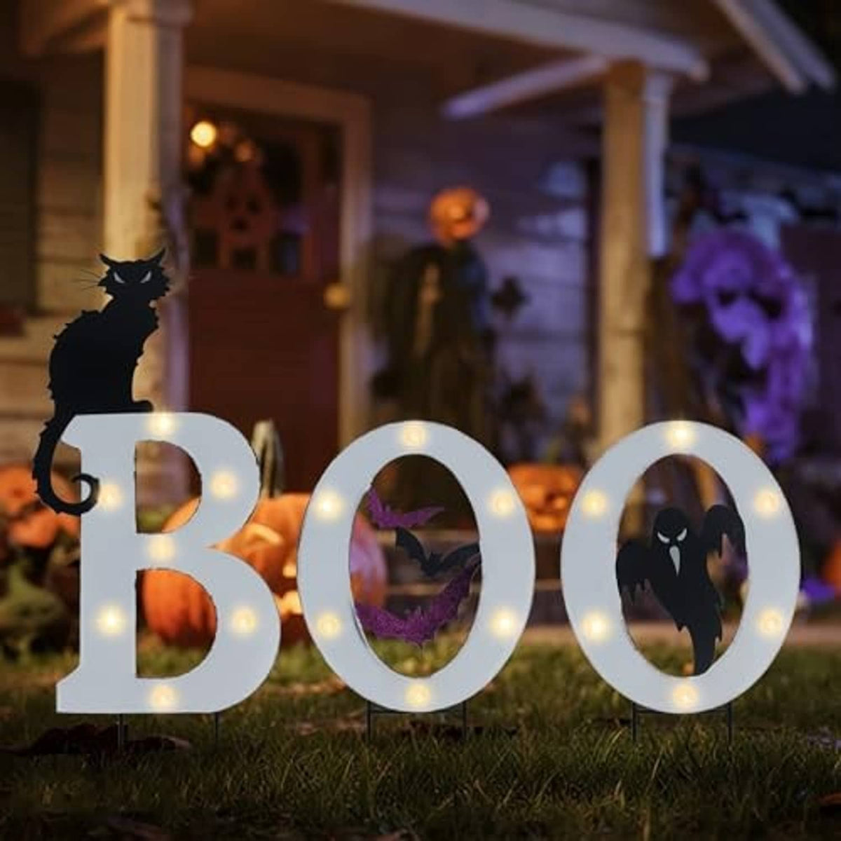 Outdoor BOO solar yard signs with glowing round LED borders and bat, cat, ghost cutouts