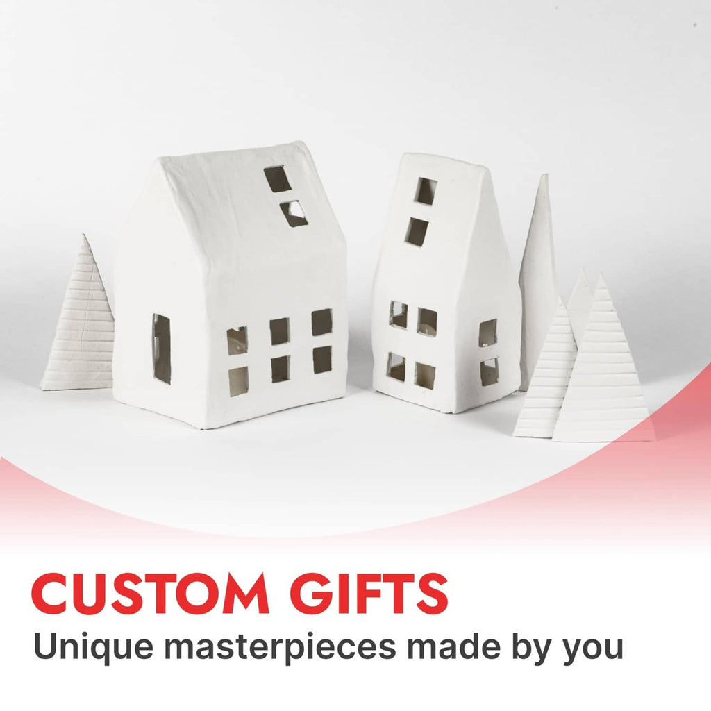 Air-dry clay custom houses: white miniature buildings with window cutouts